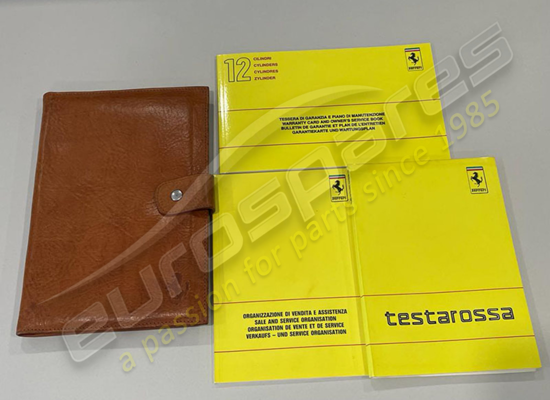 used ferrari testarossa pouch & book pack. part number eap1447998 (1)