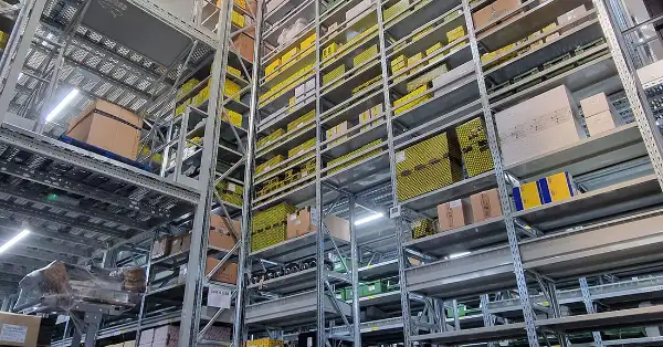 Hundreds of Ferrari parts neatly stored on floor to ceiling racking inside a Eurospares warehouse.