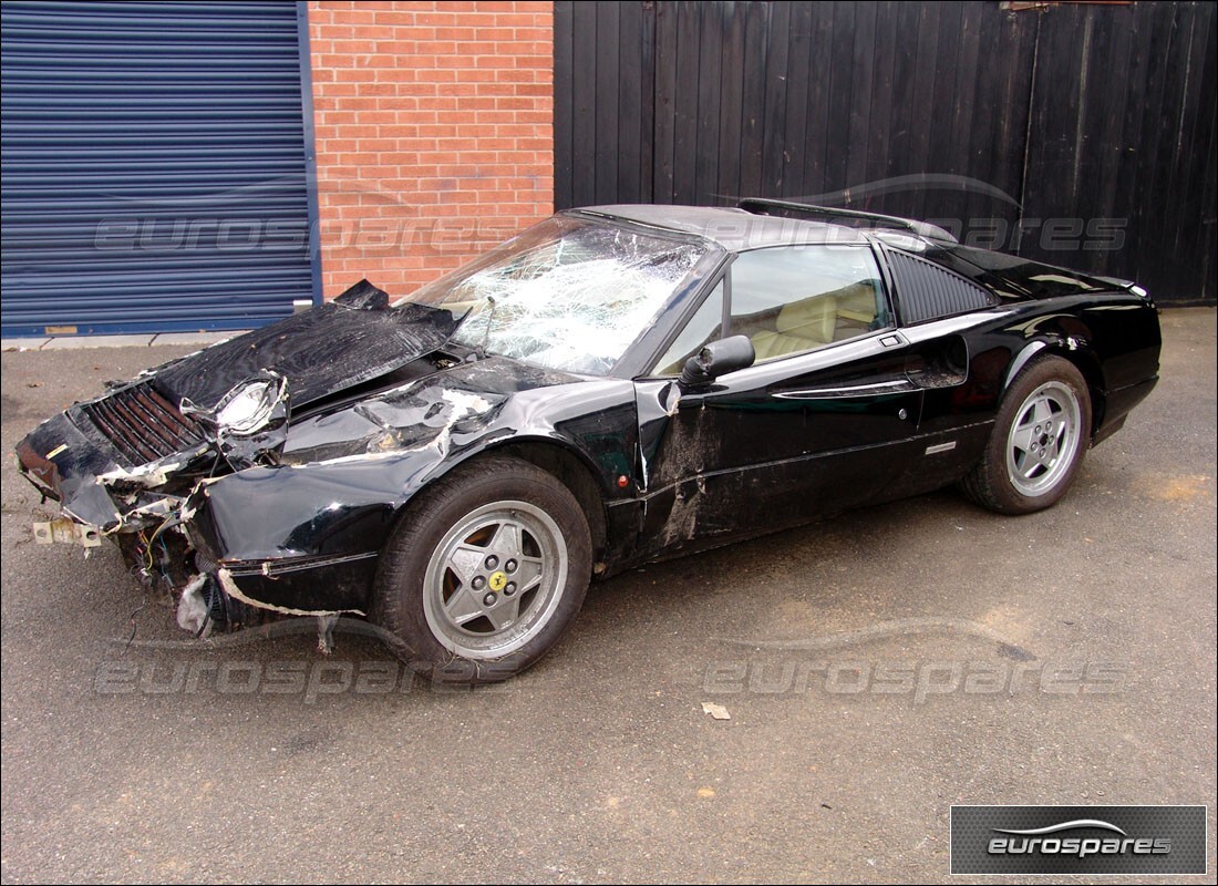 Ferrari 328 (1988) getting ready to be stripped for parts at Eurospares
