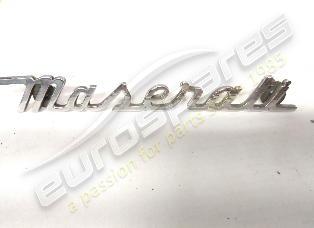 used maserati chrome script. part number 107bv57591 (1)
