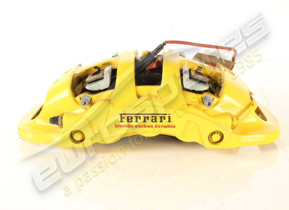 used ferrari front lh caliper with pads part number 322140