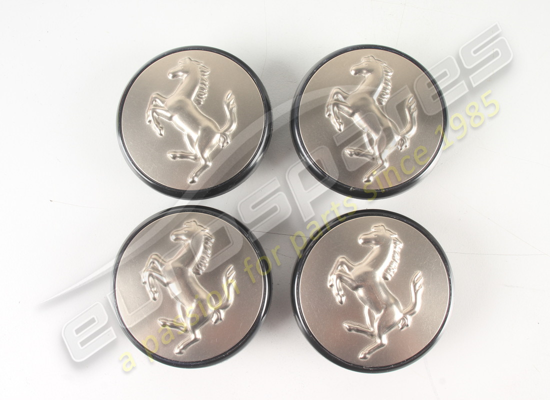 new ferrari set 4 titanium push in hub caps. part number 70001285 (1)