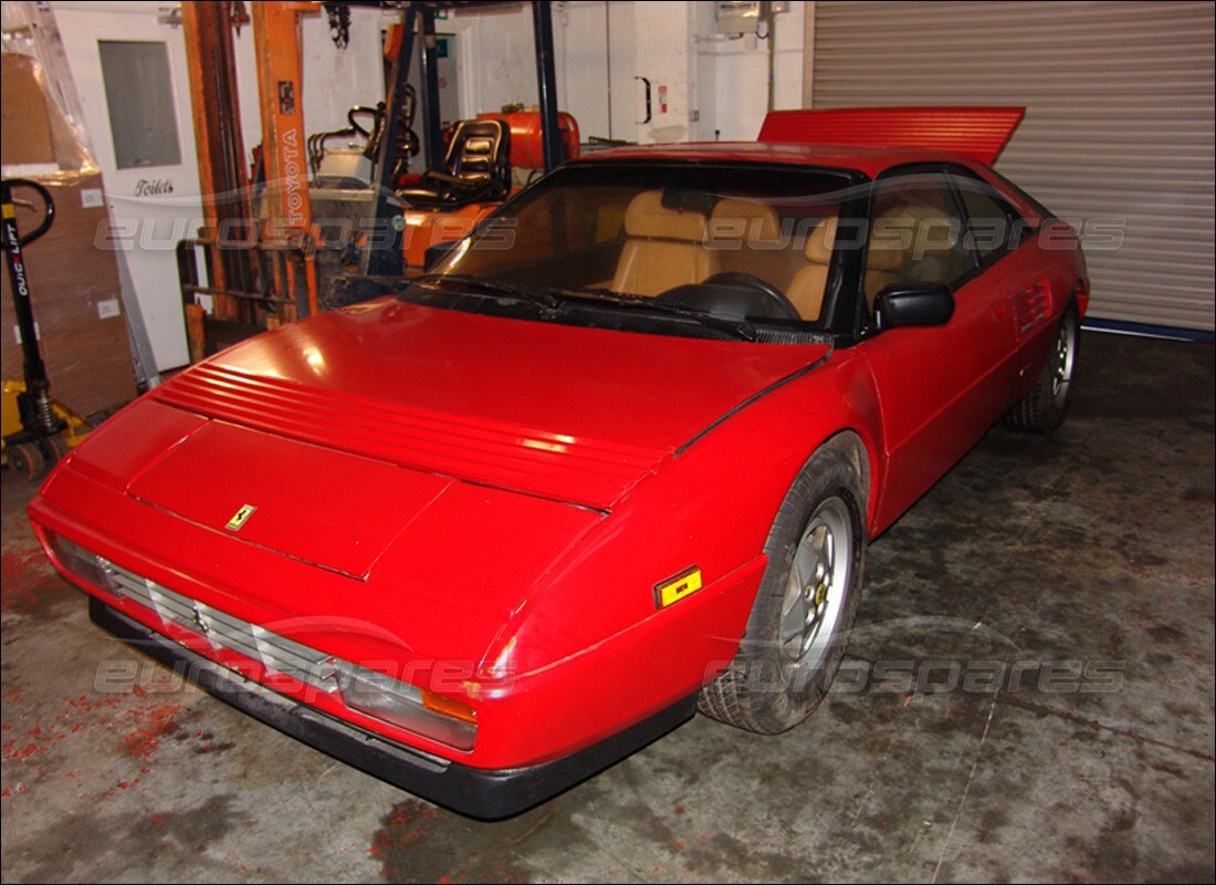 ferrari mondial 3.4 t coupe/cabrio being prepared for dismantling at eurospares